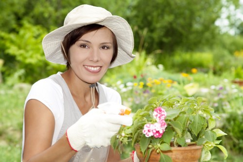 Worker assessing hazards during a landscaping task